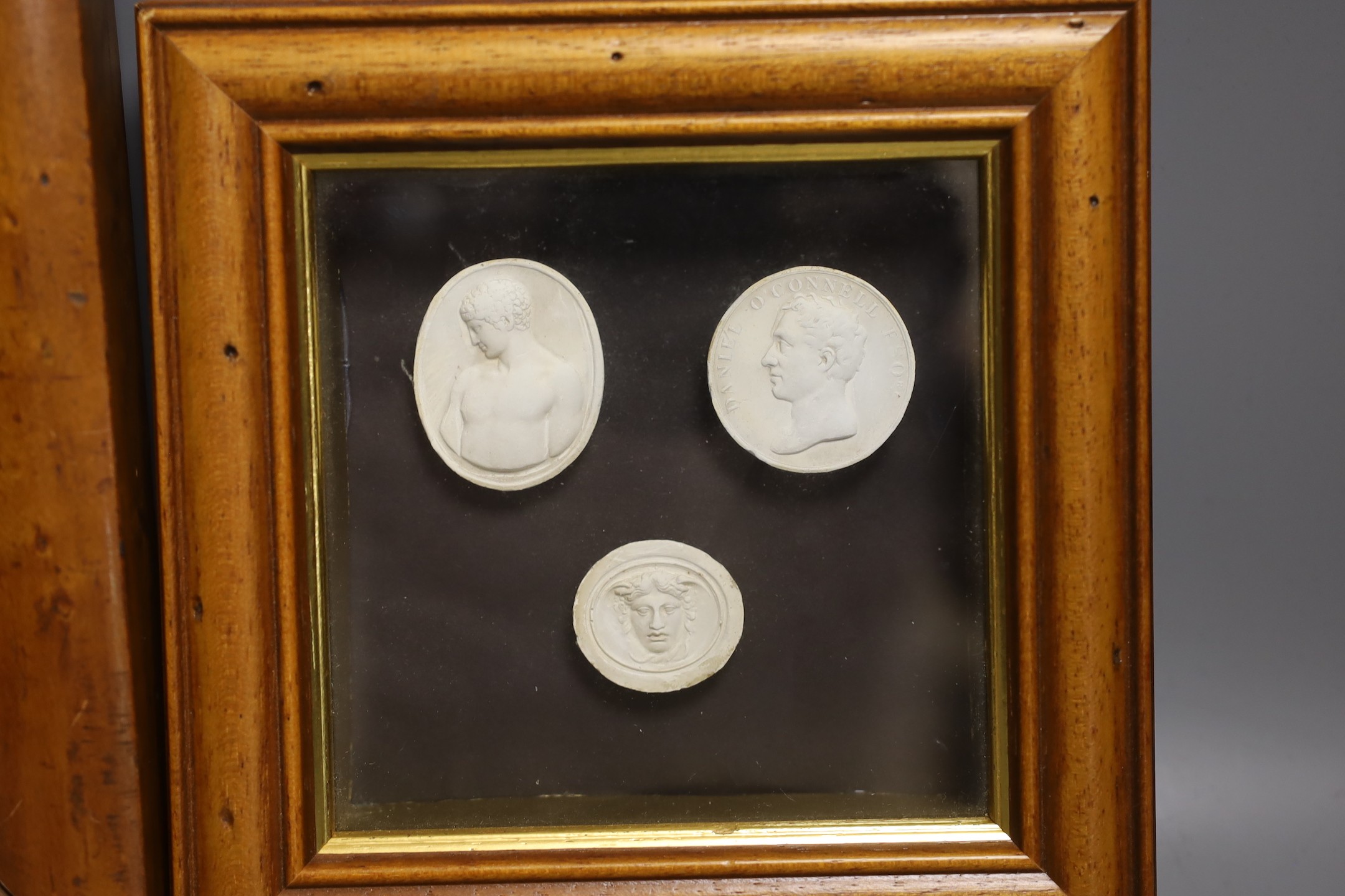 Two framed groups of classical portrait reliefs